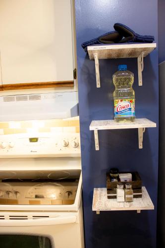 a kitchen with a bottle of cocacola in a refrigerator at Timeless - Victorian Home stay in Mankato
