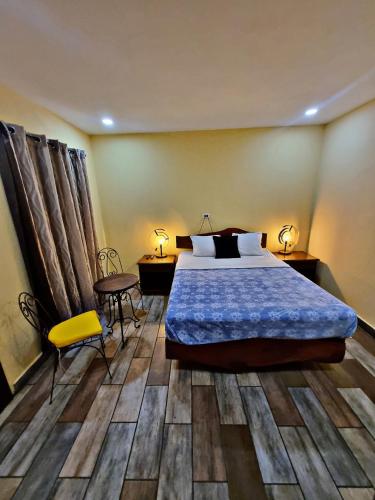 Кровать или кровати в номере Hostal Juarez Ataco