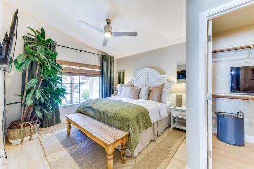 a bedroom with a large bed and a bench at Updated Gilbert Home with Covered Patio in Gilbert