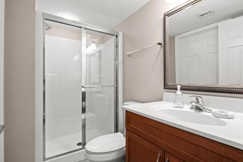 a bathroom with a toilet and a sink and a shower at Bahama Sands 1204 in Myrtle Beach