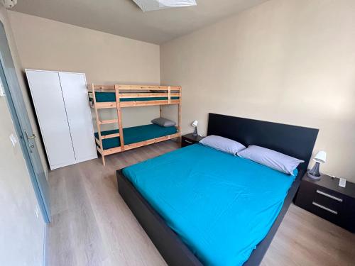 En eller flere senge i et værelse på Egles Apartments Lignano Sabbiadoro Arena Beach