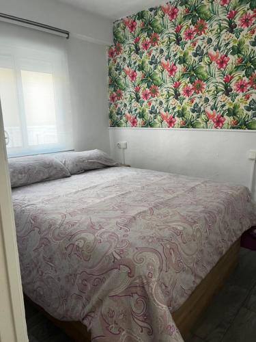A bed or beds in a room at CERCAMAR - Playa de Oliva, Paupi
