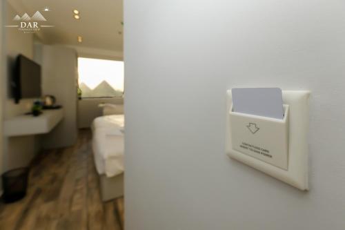 a hotel room with a box on the wall at La Casa in Cairo