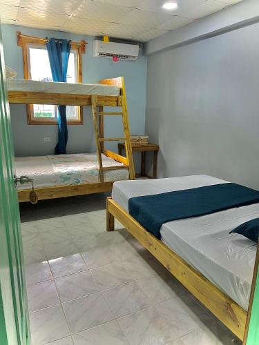 Ένα ή περισσότερα κρεβάτια σε δωμάτιο στο Dreamer's Hostel