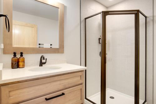 a bathroom with a sink and a shower at Outdoor Wet Bar Spacious Eagle River Retreat! in Eagle River
