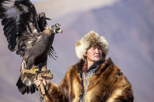 a man with a bird on his arm at Gobi-Girl in Ulaanbaatar