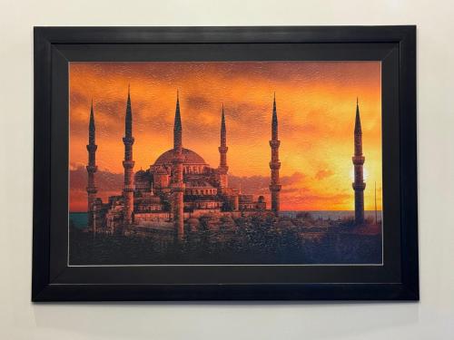 a painting of theultan ahmed mosque at sunset at Bridge Residency-2 Top City-1 Islamabad in Islamabad