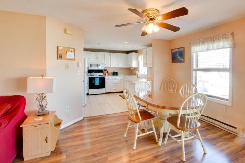 a kitchen and dining room with a table and chairs at Beachfront Old Orchard Beach Condo with Balcony in Old Orchard Beach