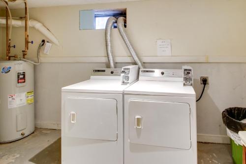 two washing machines in a room with a window at Beachfront Old Orchard Beach Condo with Balcony in Old Orchard Beach