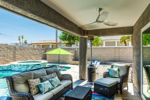 a patio with a couch and chairs next to a swimming pool at Coral Havasu Vacation in Lake Havasu City
