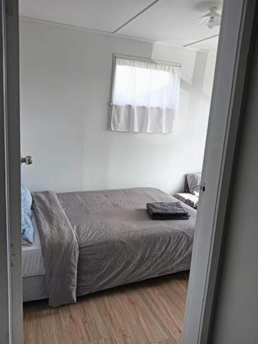 Ένα ή περισσότερα κρεβάτια σε δωμάτιο στο Serviced 3 Bedroom House