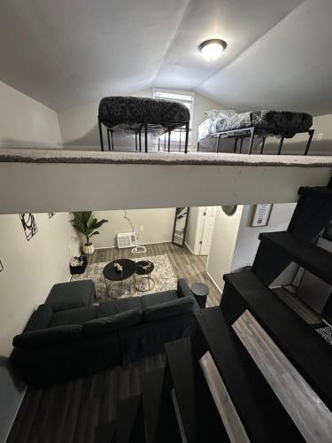 an overhead view of a living room with a couch and a bed at Our modern tiny home in Terre Haute