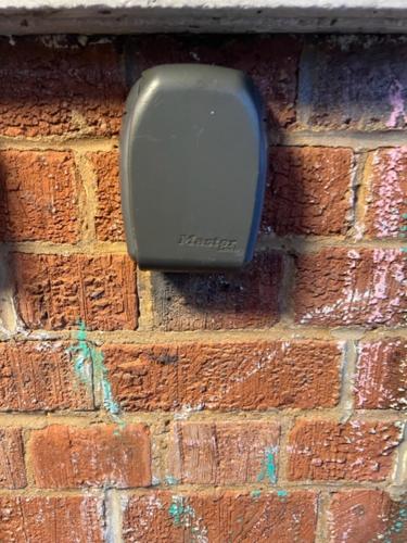 a brick wall with a soap dispenser on it at Royal Height - 3 bed in Wembley in London