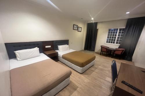 Postel nebo postele na pokoji v ubytování Iris House Hotel