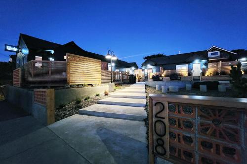 a row of houses at night with lights at The Salome - ADA Accessible at The Louie Boutique Motel, Walk to Everything! Dog Friendly! in Newport