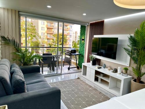 TV a/nebo společenská místnost v ubytování Apartamento luxury Girardot