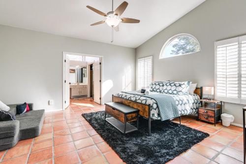 a bedroom with a bed and a ceiling fan at 3 Mi to Dtwn Home with Heated Pool in Gilbert in Gilbert
