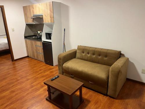 a living room with a couch and a coffee table at Apartments Attard in La Paz