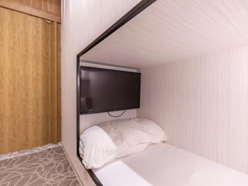 Ένα ή περισσότερα κρεβάτια σε δωμάτιο στο Trust Hotel
