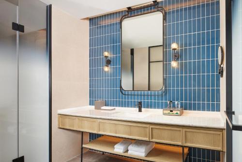 a bathroom with a sink and a mirror at Four Points by Sheraton Xuancheng, Jingxian in Jingxian