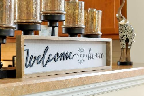 a sign on a counter with a coffee machine at Home Near Disney Private Pool & Playground in Howey in the Hills
