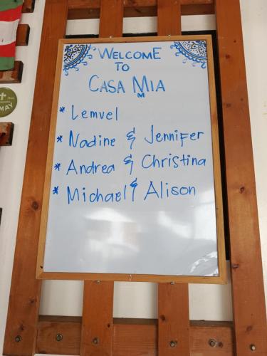 a white board with the names of different countries at CASA MIA INN in Dauis