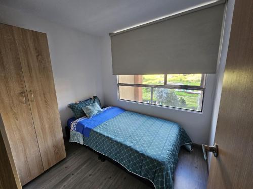 Ένα ή περισσότερα κρεβάτια σε δωμάτιο στο CTIC Apartamento Amoblado Norte en Bogota