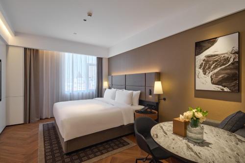 Postel nebo postele na pokoji v ubytování Panjin Xianghai Avenue Intercity Hotel