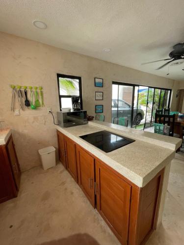 a kitchen with a counter and a sink in it at Casa colibrí in Río Lagartos