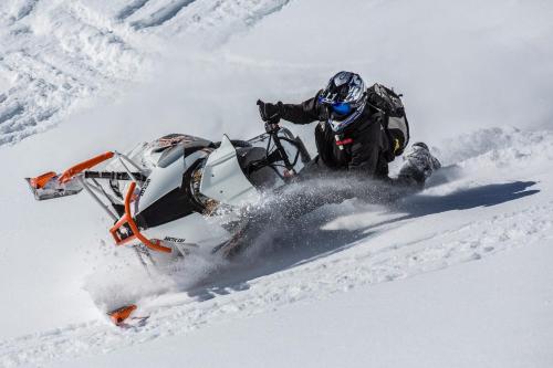 a person on a snowmobile in the snow at Teton Harmony in Driggs