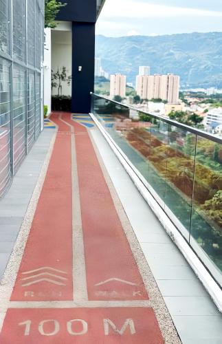 a red walkway on the side of a building at Urban Suites George Town in Jelutong