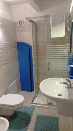 a bathroom with a sink and a toilet and a shower at Bufi de Nichilo locazione turistica occ. in Molfetta