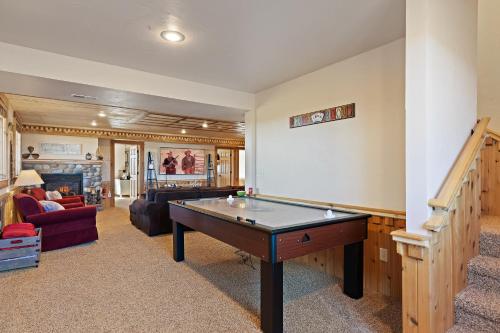 a living room with a pool table in it at Hint of Heaven in Island Park