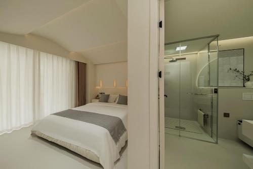 Un baño de Xishuangbanna Weilanzhuang Viila