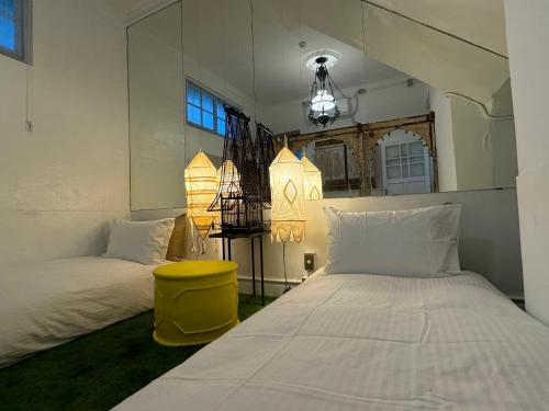 Postel nebo postele na pokoji v ubytování No2 Tainan