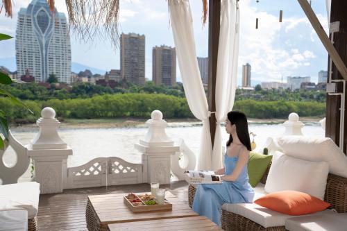 Un lugar para sentarse en Xishuangbanna Weilanzhuang Viila