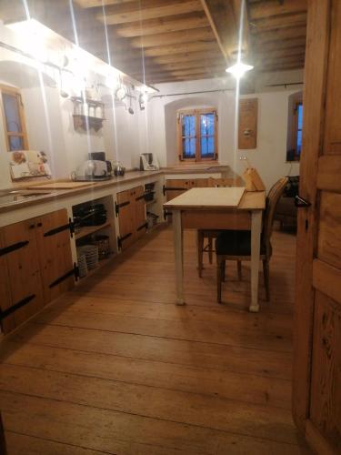 a kitchen with a table in the middle of it at Völtl-Hof in Büchlberg