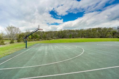 an empty basketball court with a basketball hoop at Pet-Friendly Cabin Overlooking Sleepy Hollow Lake in Athens