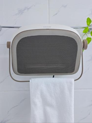 a towel rack with a speaker and a towel at Stay house in Jeonju