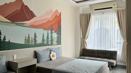 a bedroom with a bed with a teddy bear on it at Lá Homestay in Mỹ Phước