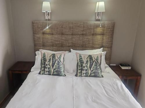 Ένα ή περισσότερα κρεβάτια σε δωμάτιο στο Gariep Country Lodge
