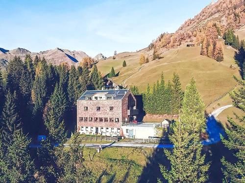 a large building in the middle of a mountain at Apartment in Tyrol near Ski Slopes in Navis