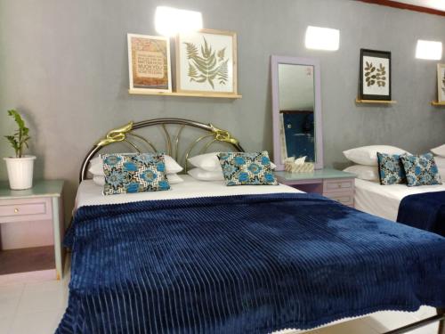 Postel nebo postele na pokoji v ubytování Villa Puri