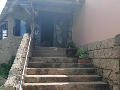 a set of stairs leading up to a house at Jozini Lebombo Lodge in Jozini