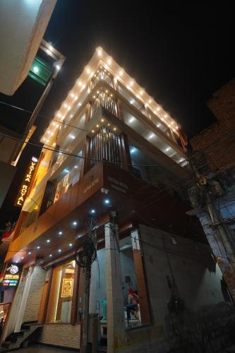 a building with lights on top of it at night at Hotel Vatika Royal in Mathura