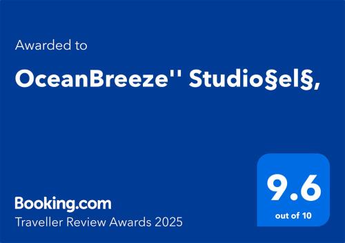 a blue sign with the words ocanberraembedlishes at "OceanBreeze'' Studio in Gaios
