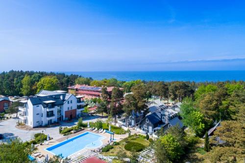 Bazén v ubytování APARTAMENTY przy plaży z basenem z podgrzewaną wodą i mini SPA - Ośrodek Kolonijno-Wczasowy Mewa nebo v jeho okolí