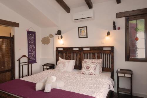 a bedroom with a bed with a towel on it at Finca Amorosa in Villanueva de la Concepción