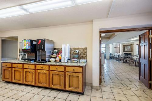 a kitchen with a counter with a coffee maker on it at Quality Inn & Suites at Dollywood Lane in Pigeon Forge