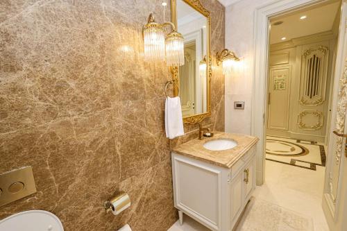 a bathroom with a sink and a mirror at Hilton Garden Inn Samarkand Sogd in Samarkand